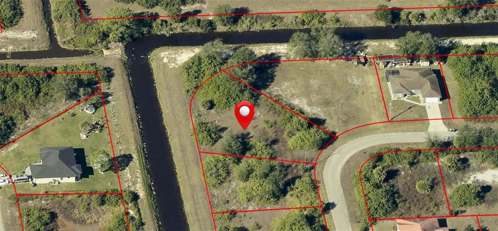This is an aerial map view of a vacant residential lot with a red location pin — 608 CHEMSTRAND STREET E, LEHIGH ACRES, FL