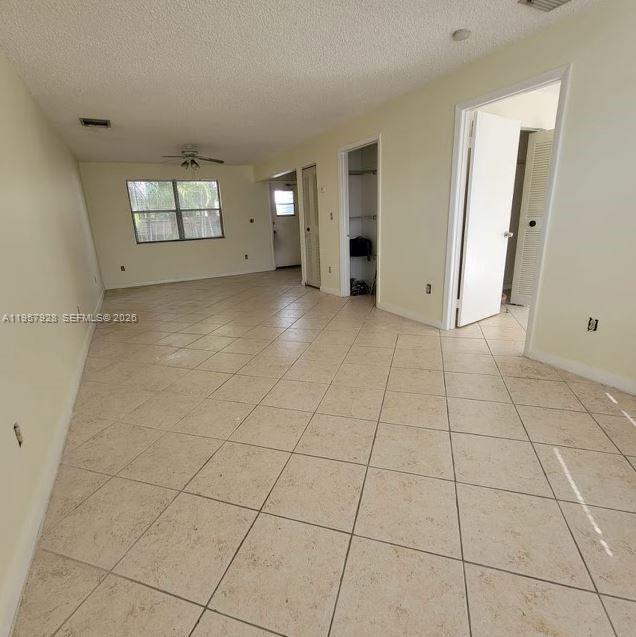 A white kitchen features marble-patterned countertops, a stainless steel sink, and a white stove — 814 Finley Ct, Hollywood FL 33020, HOLLYWOOD, FL