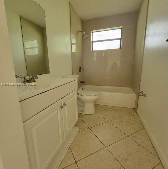A kitchen features white cabinets, a white refrigerator, a stove, and a tiled floor — 814 Finley Ct, Hollywood FL 33020, HOLLYWOOD, FL