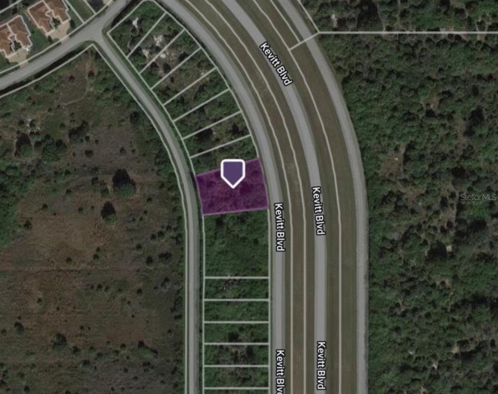 This is a satellite map view showing a highlighted vacant residential lot along a curved road — 6401 & 6365 KEVITT BOULEVARD, PORT CHARLOTTE, FL