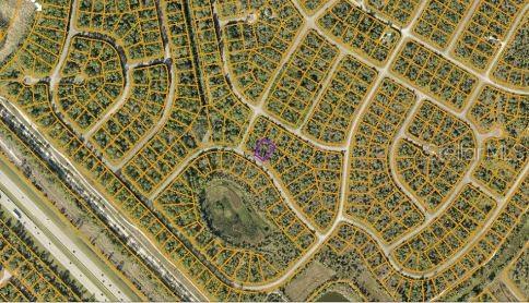 This aerial map shows a residential neighborhood with outlined property lots and a highlighted parcel — HIAWATHA TERRACE, NORTH PORT, FL