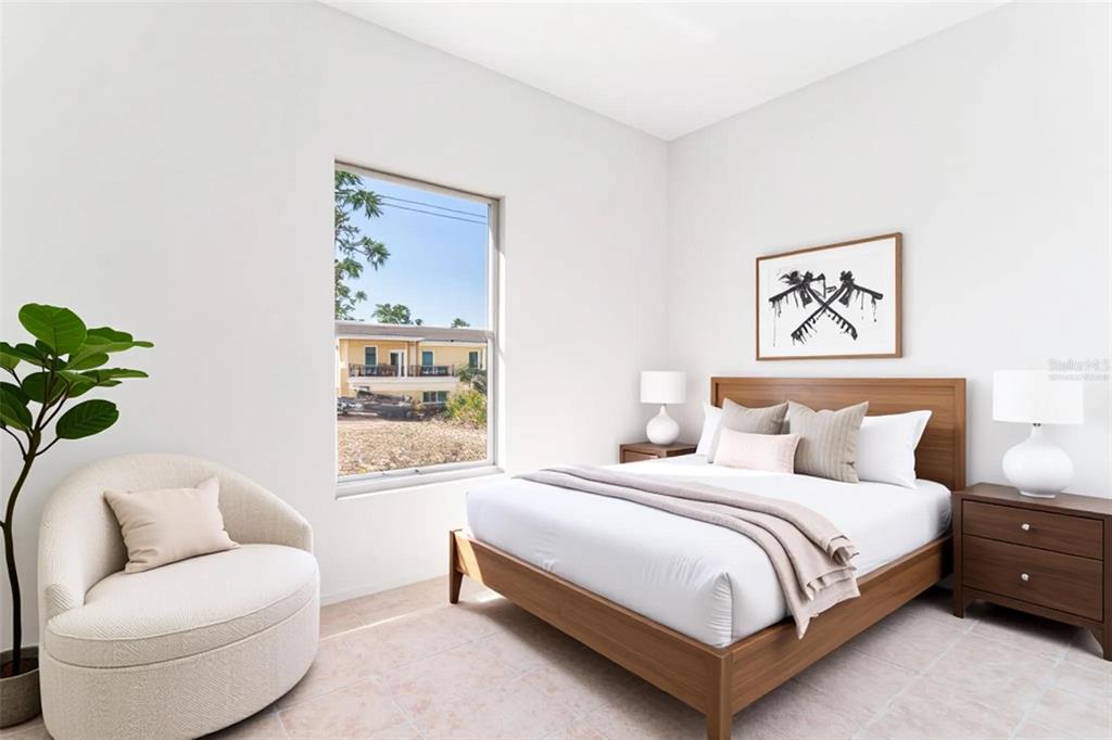 A bedroom features a wooden bed, two nightstands, a round chair, and a window view — 1406 BITTERSWEET STREET, LAKE PLACID, FL