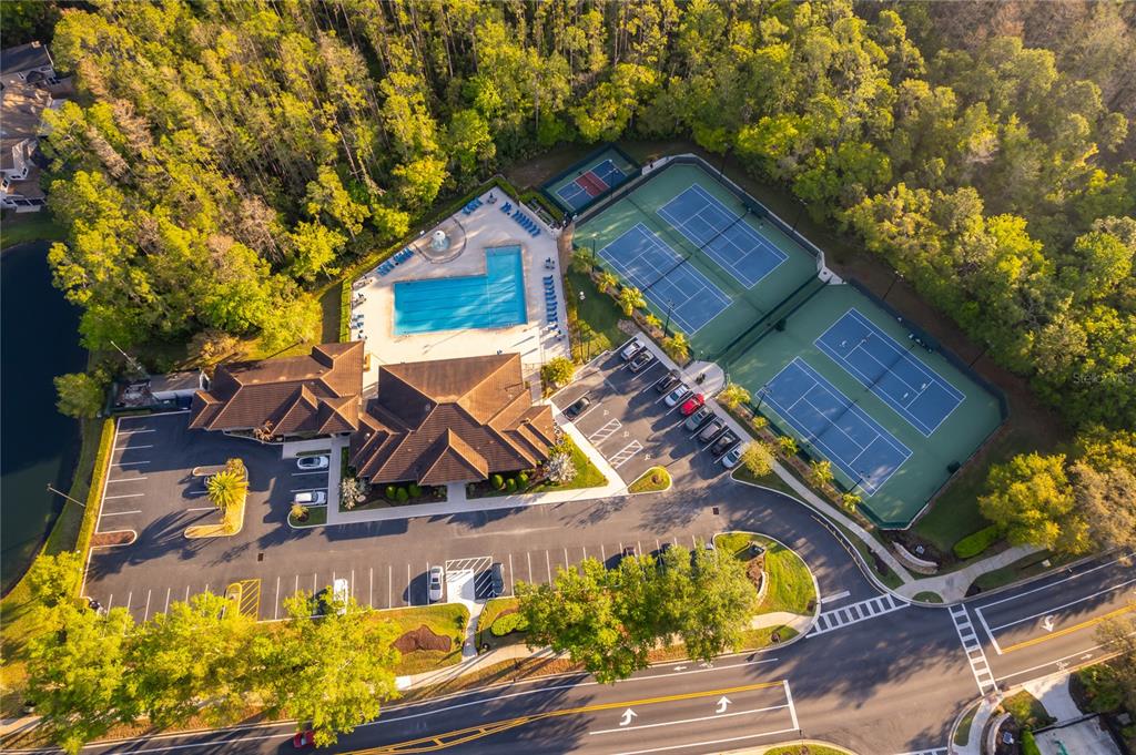 Aerial view of a community clubhouse with a swimming pool and tennis courts — 2591 DOVER GLEN CIRCLE, ORLANDO, FL