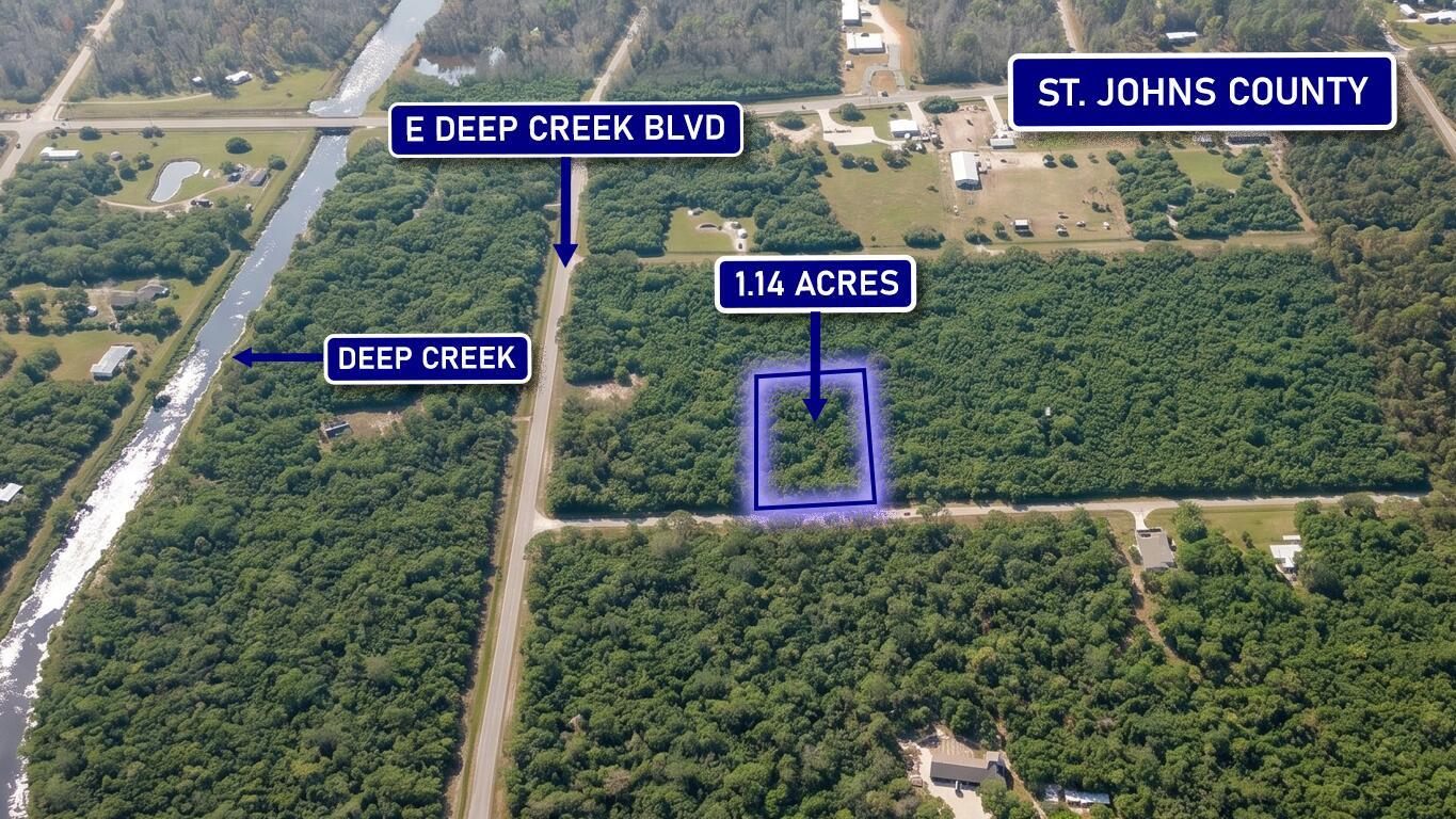 An aerial view shows a rectangular 1.14-acre wooded lot located near a road and creek — 4770 Benedict Street, FL 32145, FL