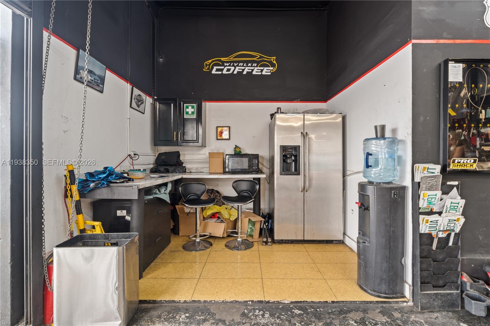 A garage break area features a refrigerator, water cooler, two stools, and a coffee station — 4350 NW 32nd Ave, Miami FL 33142, MIAMI, FL