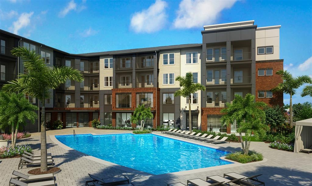 This is a rendering of an apartment complex exterior featuring a swimming pool and lounge chairs — 35820 N US HWY 19 UNIT A2, PALM HARBOR, FL