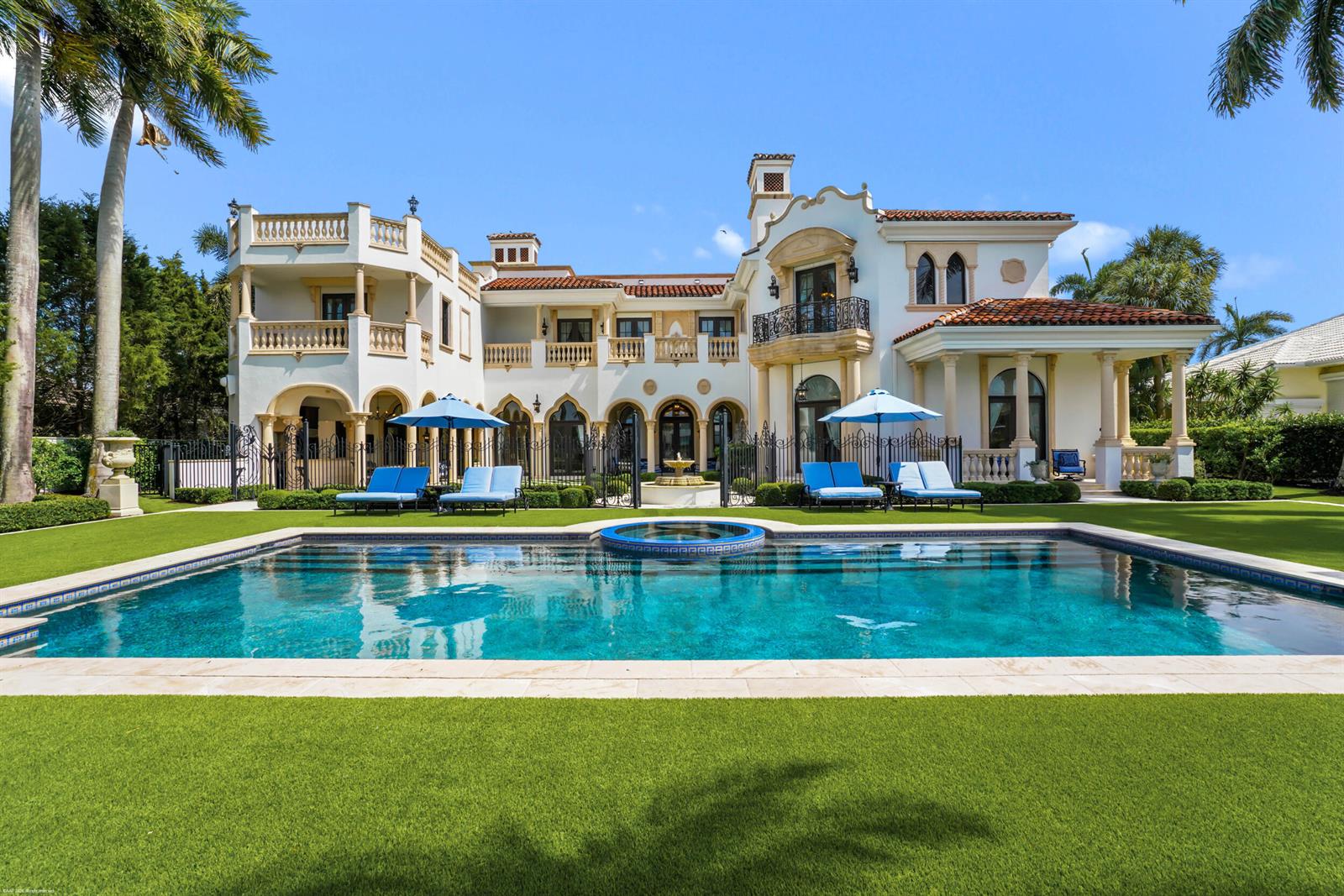 A Mediterranean-style mansion features a swimming pool, spa, and lawn in the backyard — 370 Eagle Drive, Jupiter FL 33477, JUPITER, FL