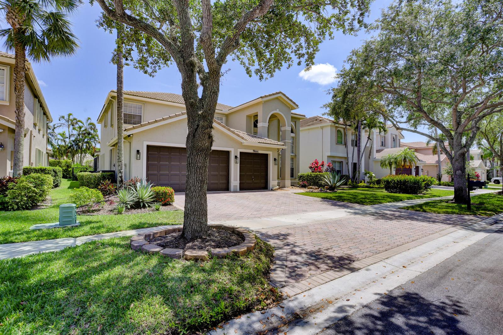 A two-story suburban house with a three-car garage and a paved driveway — 19644 Estuary Drive, Boca Raton FL 33498, BOCA RATON, FL