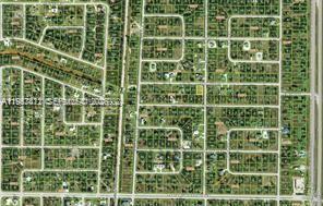 This is an aerial view of a residential neighborhood with a grid of streets — 29387 Goodhue, Punta Gorda FL 33982, PUNTA GORDA, FL