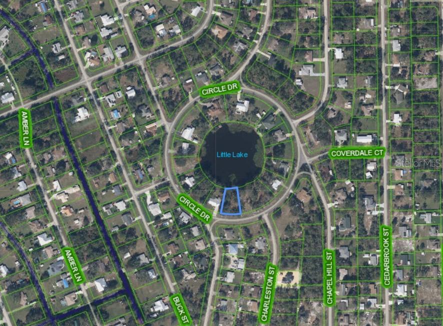 This is an aerial map showing a vacant lot highlighted in blue bordering a small lake — 1719 CIRCLE DRIVE, LAKE PLACID, FL
