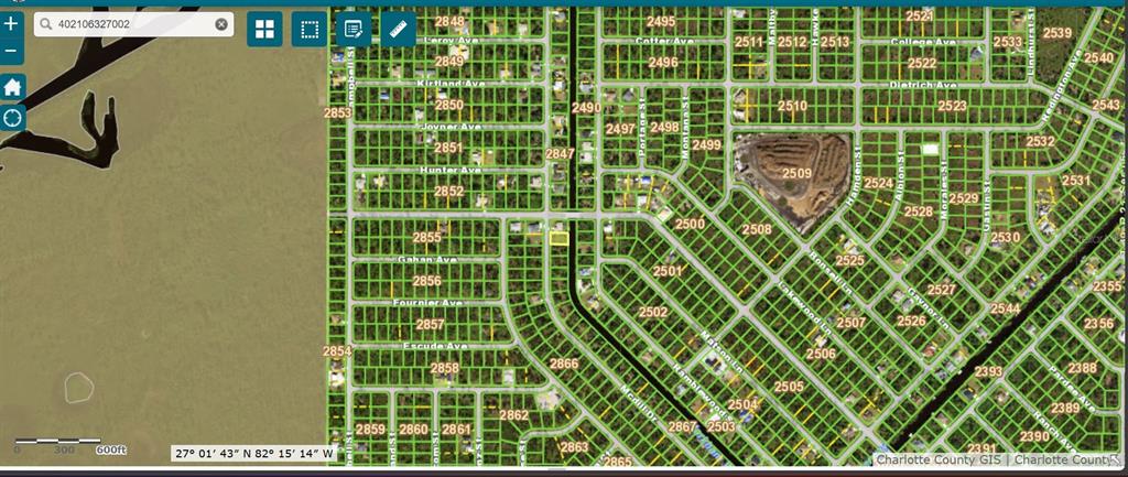 This is a digital map showing a grid of residential land parcels and street names — 306 MCDILL DRIVE, PORT CHARLOTTE, FL