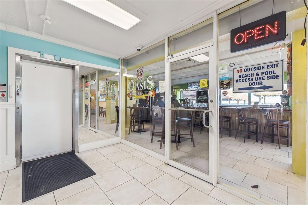 An interior view shows the entrance to the Oasis Bar and Grill with tile flooring — 313 S ATLANTIC AVENUE UNIT 2090, DAYTONA BEACH, FL