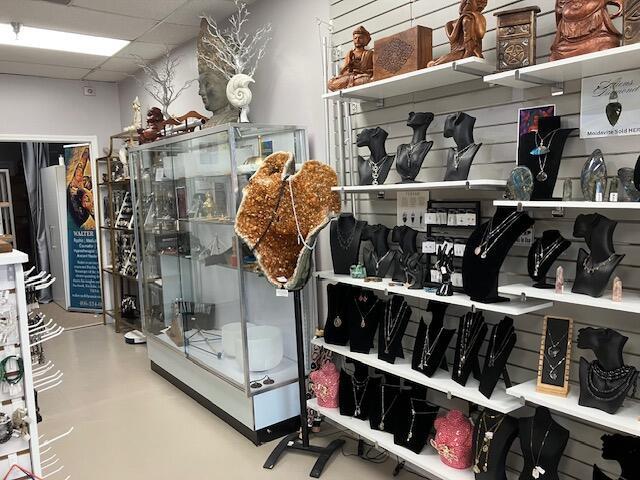 A retail shop displays jewelry on shelves and a large crystal in a glass case — 958 Northlake Boulevard, Lake Park FL 33403, LAKE PARK, FL