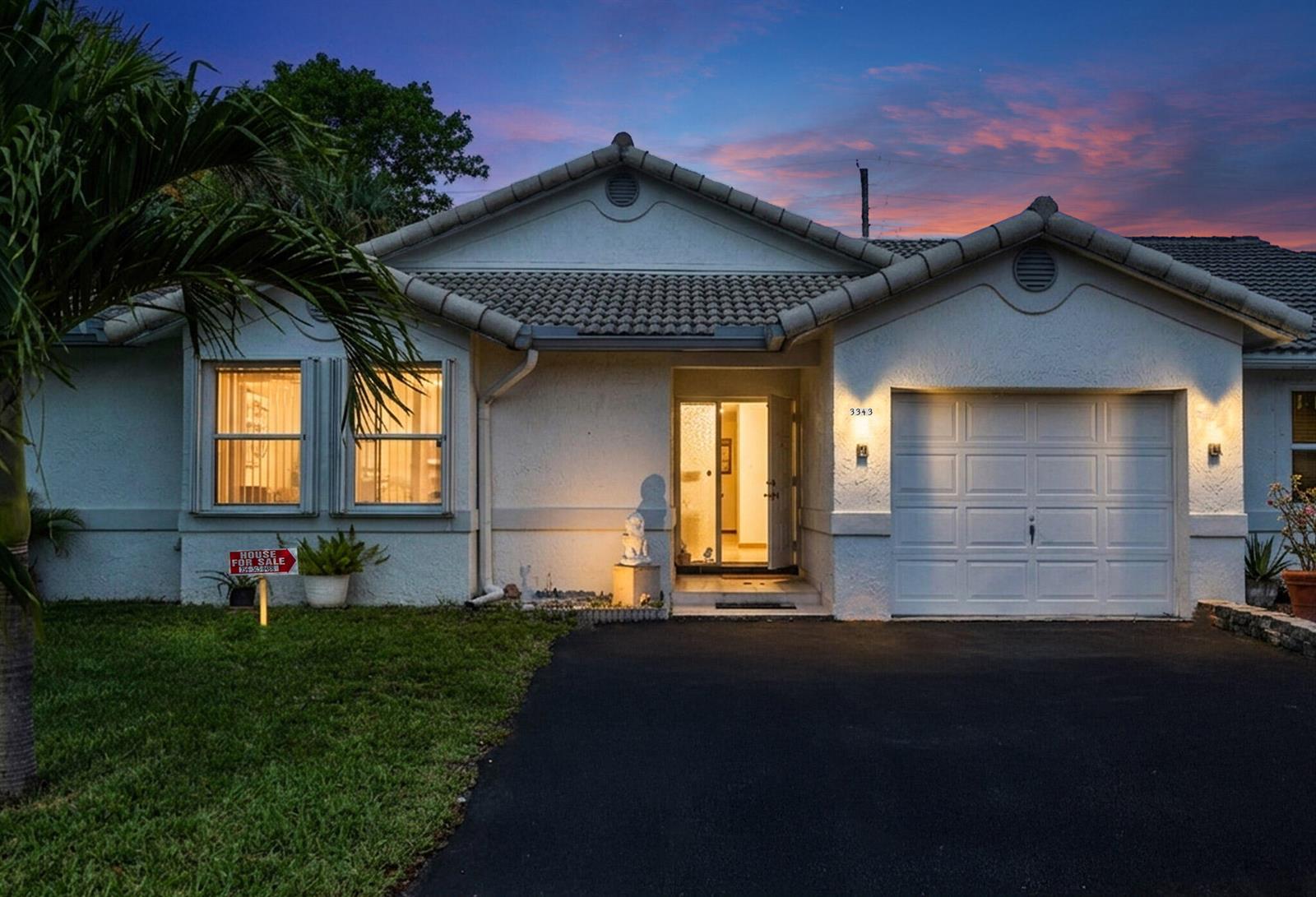 A single-story house with a white stucco exterior, tile roof, and a one-car garage — 3343 NW 79th Way, Davie FL 33024, DAVIE, FL