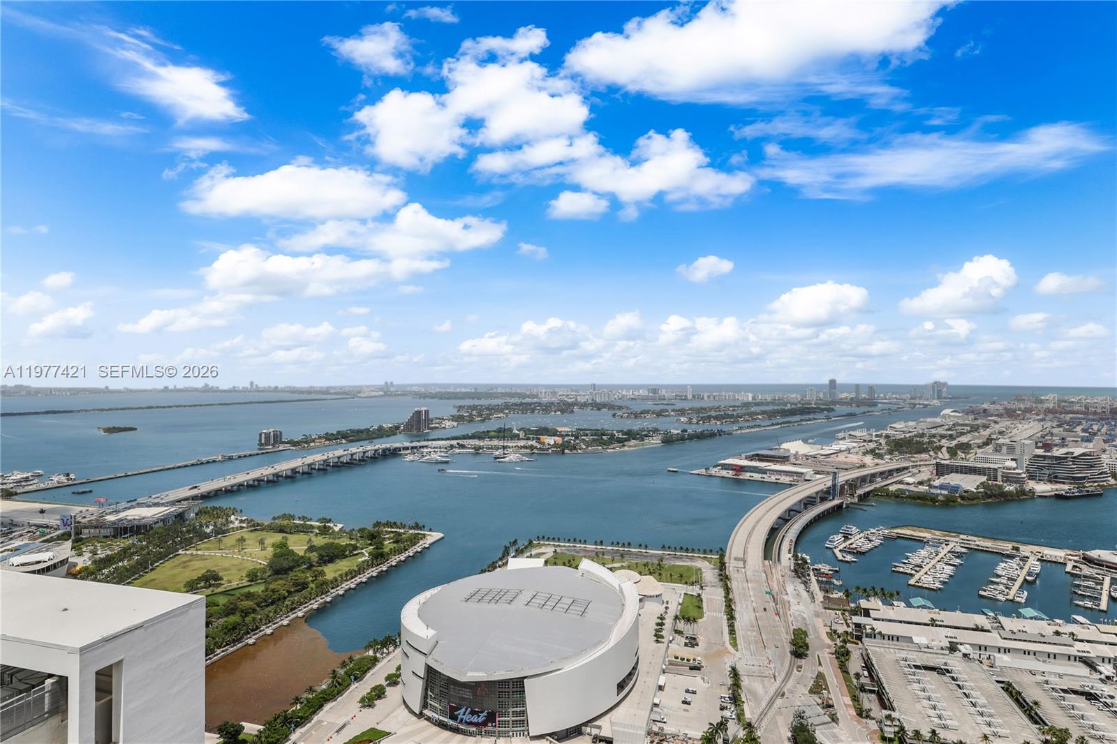 An aerial view shows the Kaseya Center, the PortMiami bridge, and Biscayne Bay in Miami — 159 NE 6th St # 5115, Miami FL 33132, MIAMI, FL