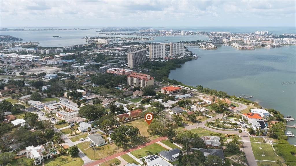 An aerial view shows a vacant lot marked with a pin in a coastal neighborhood — 698 VILLAGRANDE AVENUE S, ST PETERSBURG, FL
