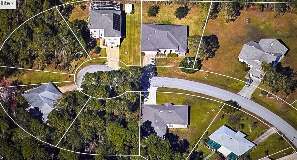 This aerial map shows several residential homes situated along a cul-de-sac in a wooded area — 15 KASBAH PLACE, PALM COAST, FL