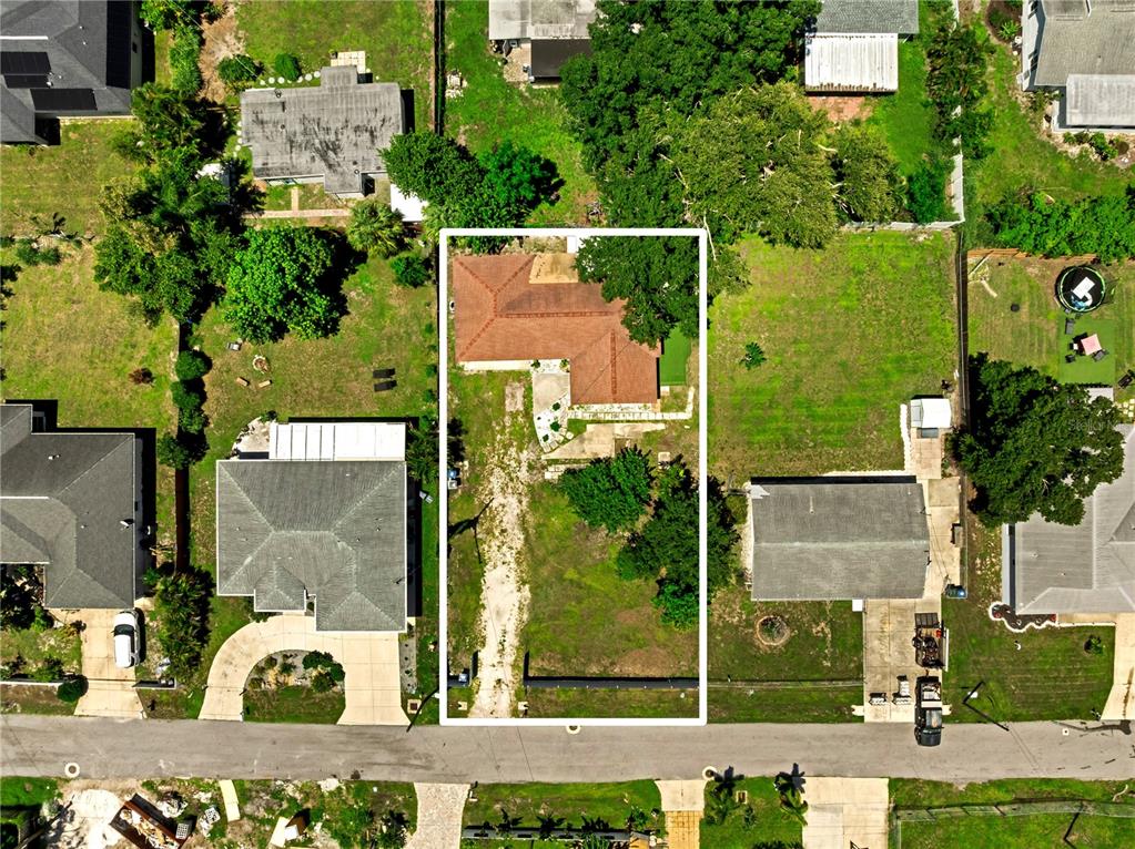 An aerial view shows a house with a brown roof centered on a rectangular lot — 2839 OLYMPIC STREET, SARASOTA, FL