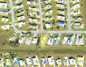 This aerial map shows a residential neighborhood with a highlighted property lot — 7437 LONGMONT LANE, PORT CHARLOTTE, FL