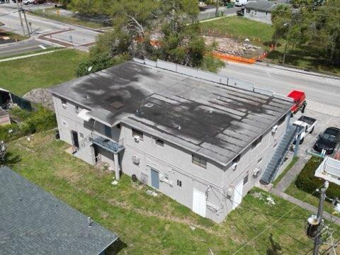An aerial view of a two-story gray apartment building with a flat roof — 602 NW 1st Street, Dania Beach FL 33004, DANIA BEACH, FL