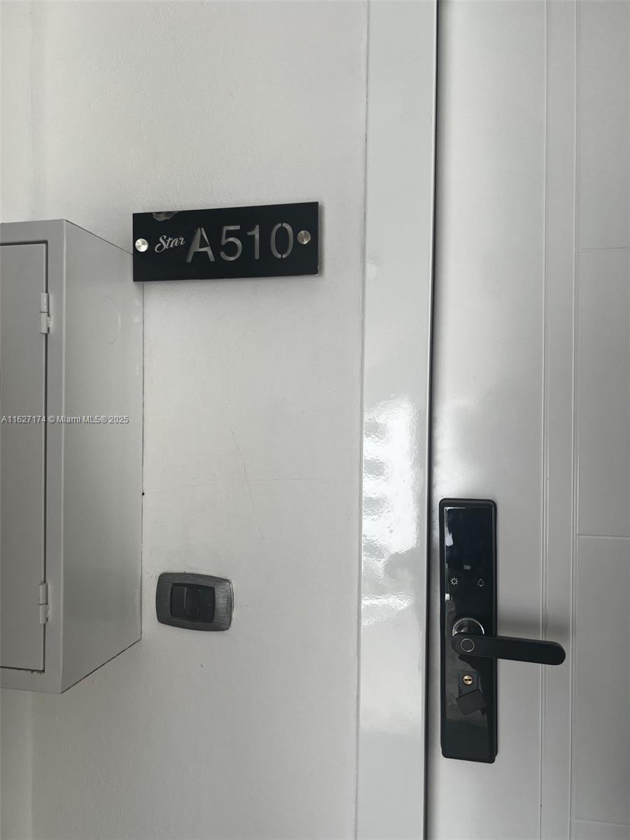 A white door features a black electronic lock and a sign labeled Star A510 — Av. Hard Rock Punta Cana 23000 #PH-510 , Dominican Republic, DR, DR