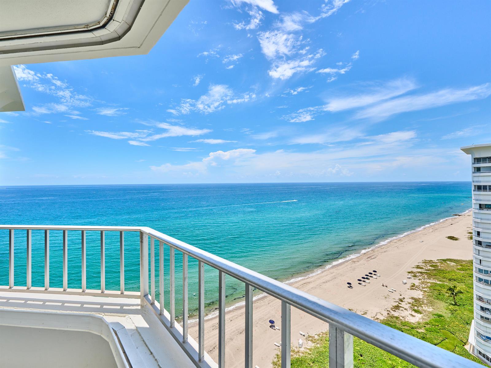 A balcony with a metal railing overlooks a sandy beach and the blue ocean — 500 S Ocean Boulevard # 2106, Boca Raton FL 33432, BOCA RATON, FL
