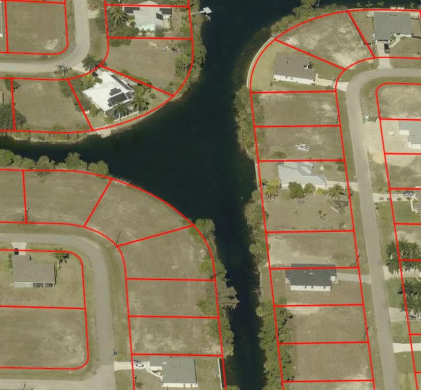 This is an aerial map view of residential lots bordering a canal — 1133 NE 32ND TERRACE, CAPE CORAL, FL