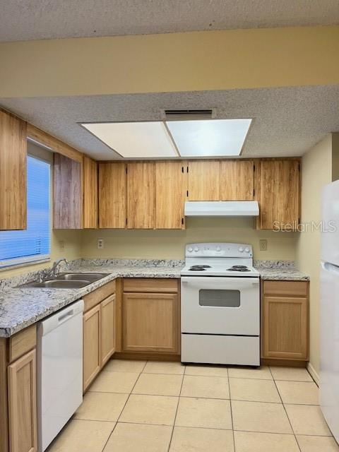 A kitchen features light wood cabinets, granite countertops, a white stove, and a white dishwasher — 821 MARGARET STREET UNIT A, DELAND, FL
