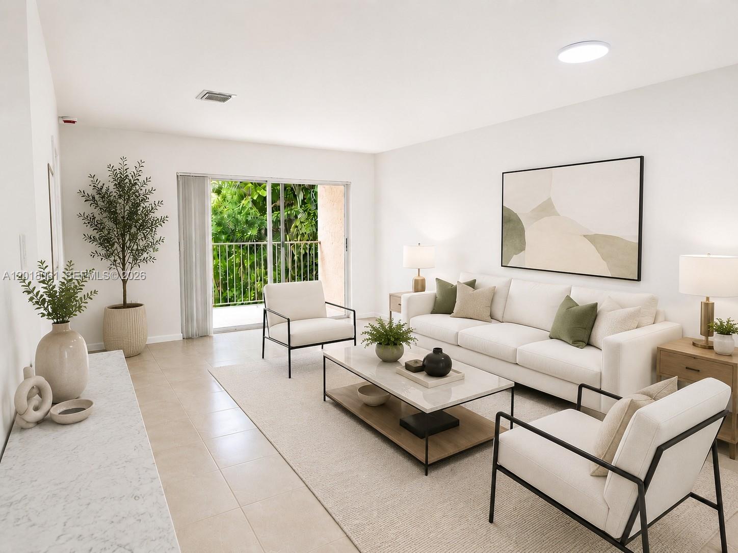 A bright living room features a white sofa, two armchairs, a coffee table, and a balcony — 15721 SW 137th Ave # 202, Miami FL 33177, MIAMI, FL