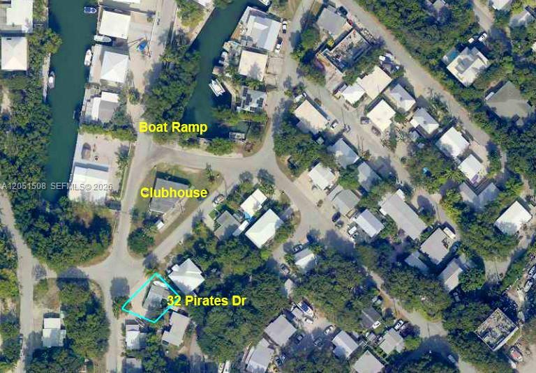 This is an aerial map view of a residential neighborhood with a highlighted property — 32 Pirates Dr, Key Largo FL 33037, KEY LARGO, FL