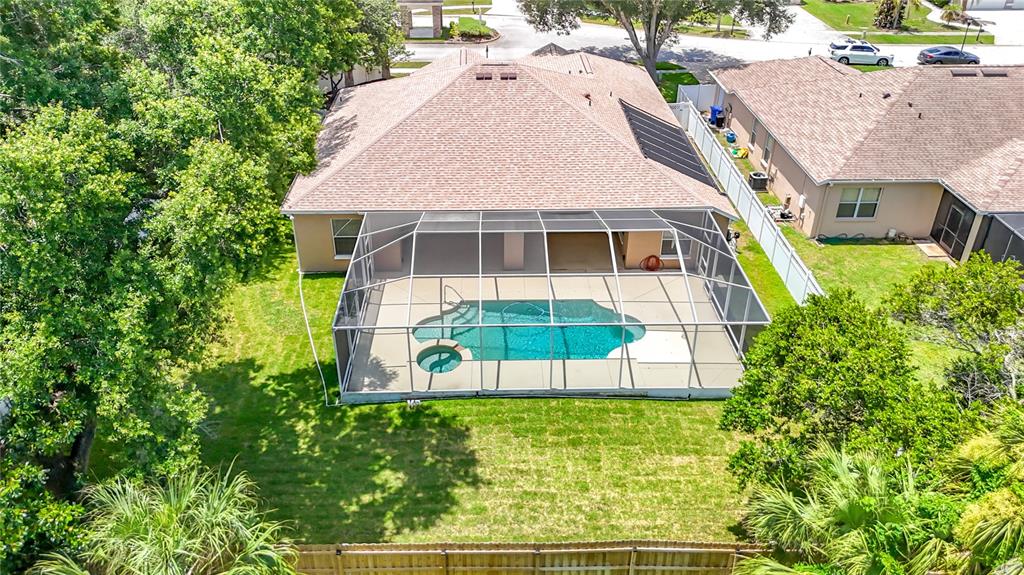 An aerial view shows a house with a screened-in pool and backyard — 2866 DUNCAN TREE CIRCLE, VALRICO, FL