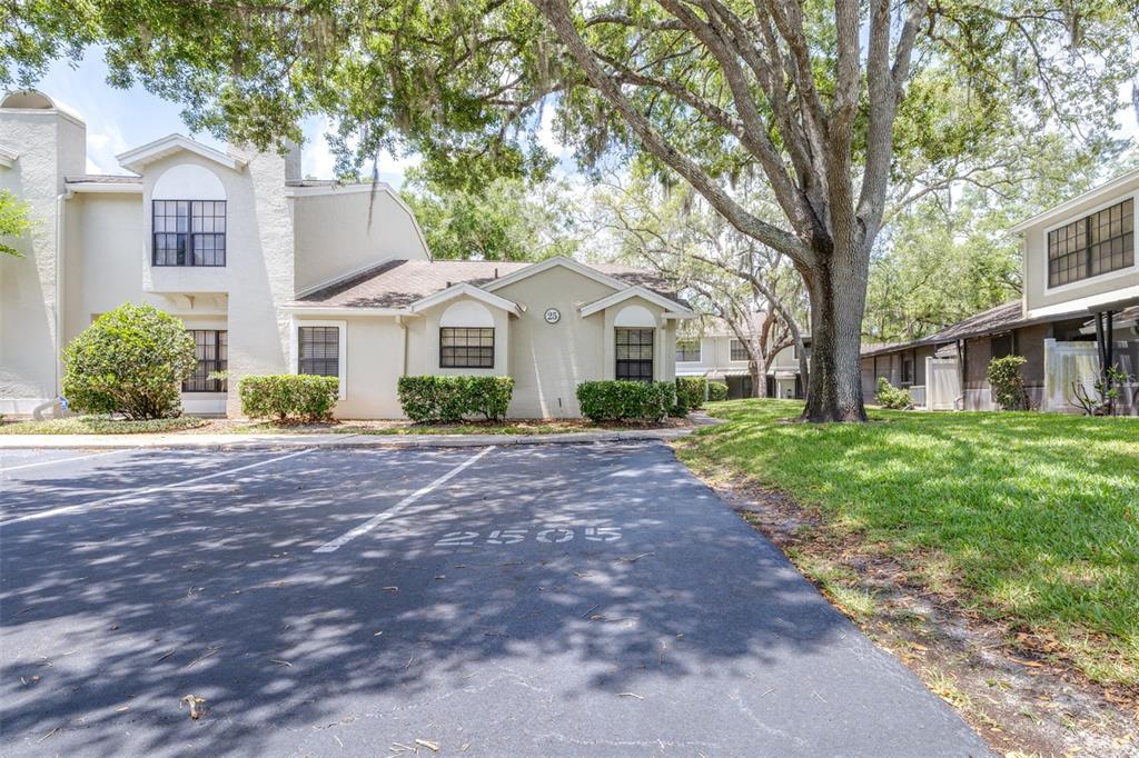 A two-story residential building with a parking space marked 2505 in the foreground — 5100 BURCHETTE ROAD UNIT 2505, TAMPA, FL
