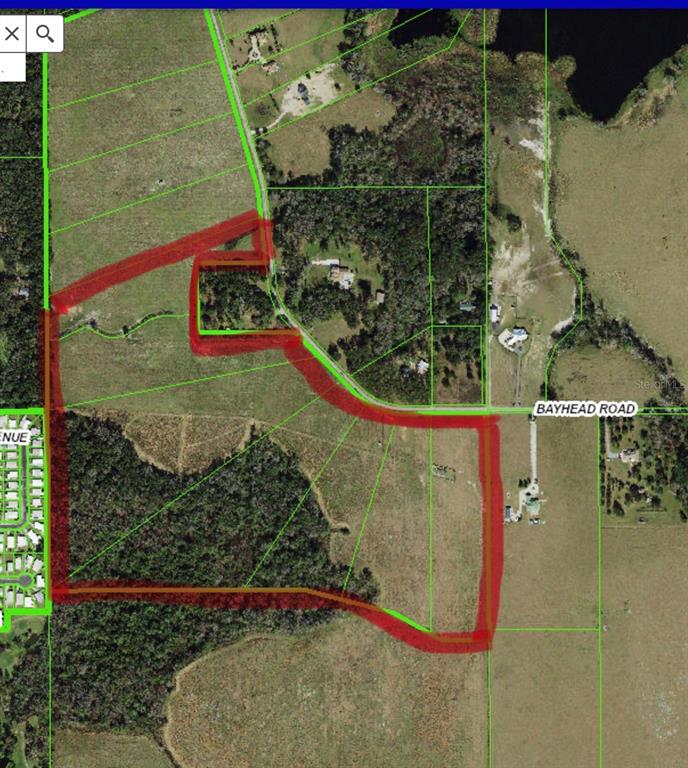 This is an aerial map showing a property boundary outlined in red over rural land — BAYHEAD ROAD Lot 5-11, DADE CITY, FL