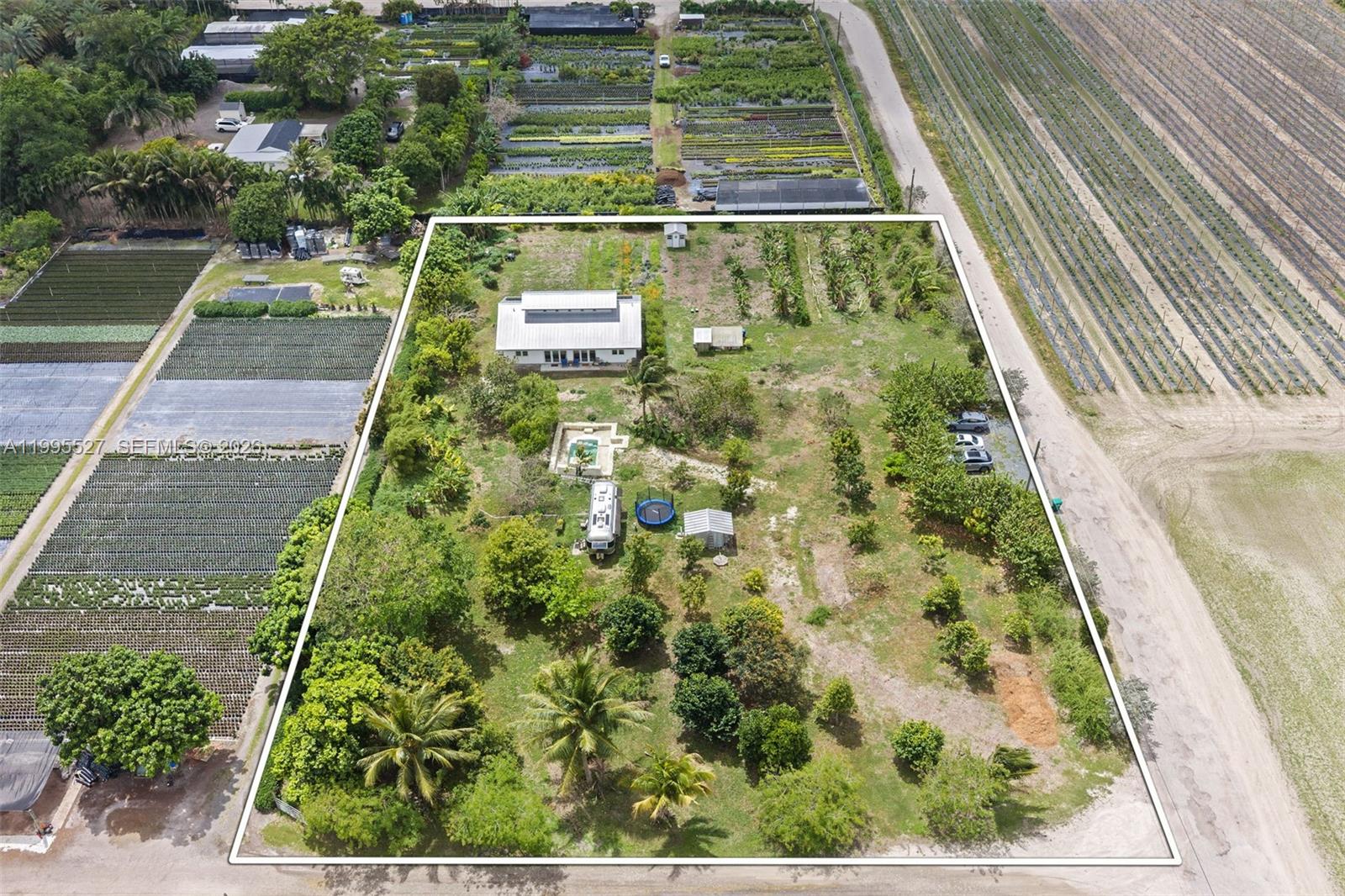 An aerial view shows a house with a pool and yard on a rural lot — 20255 SW 154th Ave, Miami FL 33187, MIAMI, FL