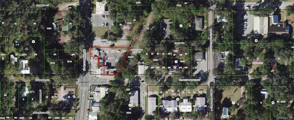 This is an aerial map showing a highlighted property lot located near a street intersection — 8307 E ORANGE AVENUE, FLORAL CITY, FL