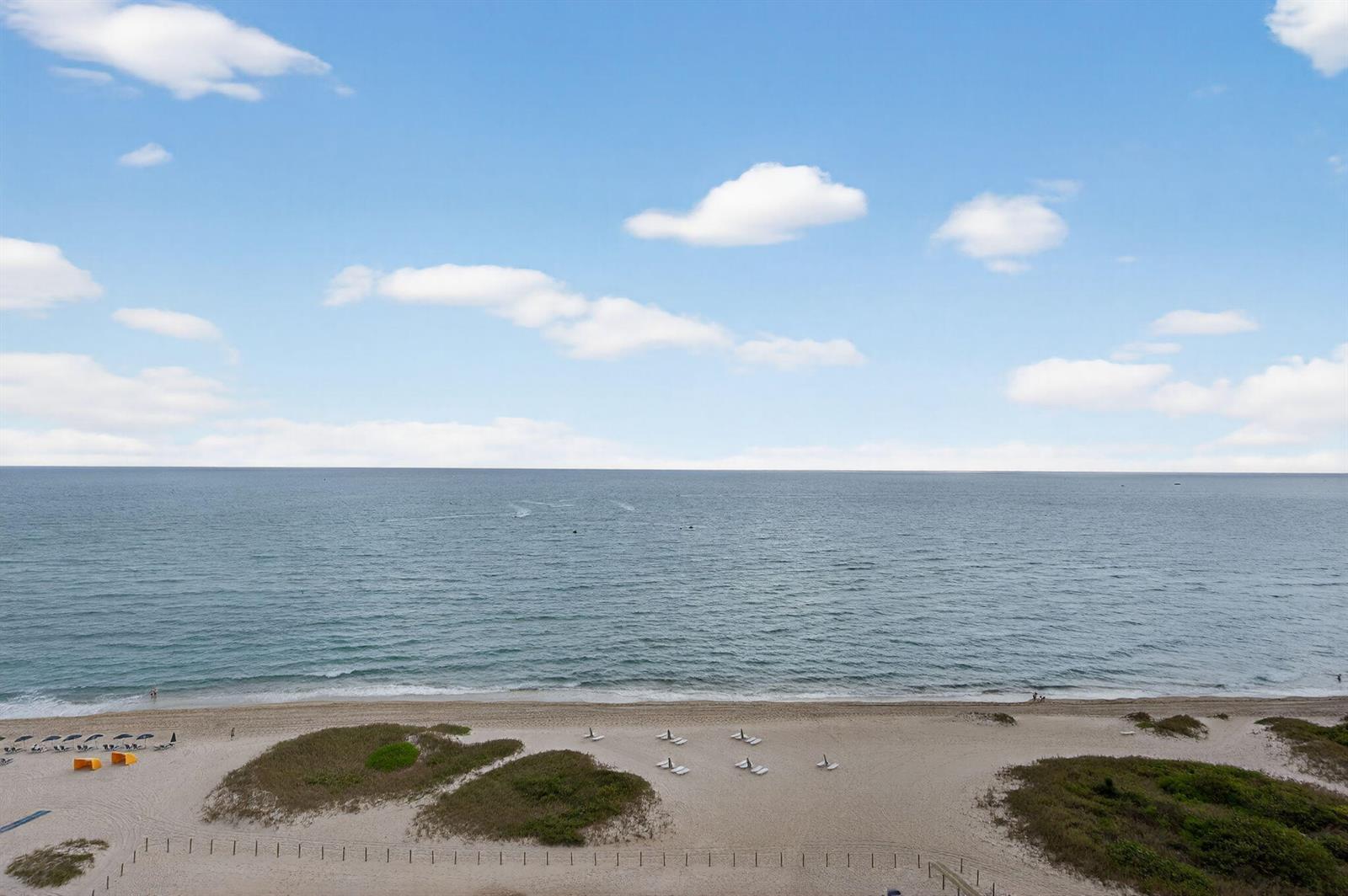 An elevated view of a sandy beach with dunes, lounge chairs, and the ocean — 1116 N Ocean Boulevard # 1204, Pompano Beach FL 33062, POMPANO BEACH, FL