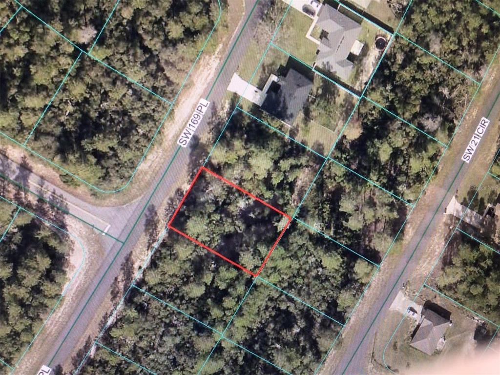 This aerial map shows a vacant, wooded residential lot outlined in red — 0 SW 169 PLACE, OCALA, FL