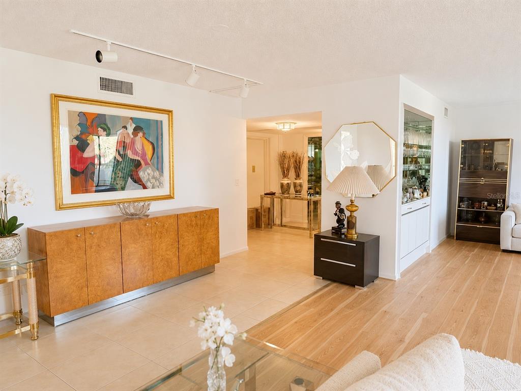 A multi-story apartment building with a circular driveway, palm trees, and a covered entrance — 4770 FOUNTAINS DRIVE S UNIT 302, LAKE WORTH, FL