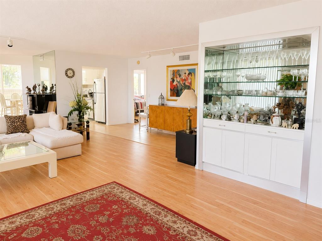 A kitchen features light-colored cabinets, a black stove, a stainless steel refrigerator, and tiled flooring — 4770 FOUNTAINS DRIVE S UNIT 302, LAKE WORTH, FL