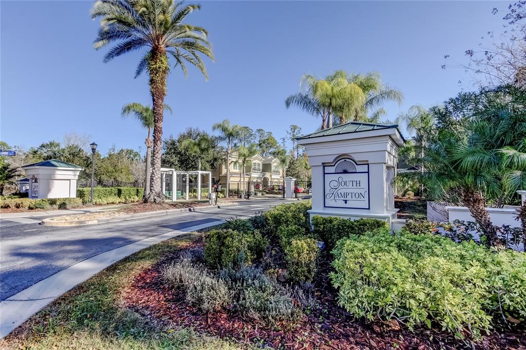 The entrance to the South Hampton community features a gated driveway and a stone sign — 12507 SILVERDALE STREET, TAMPA, FL