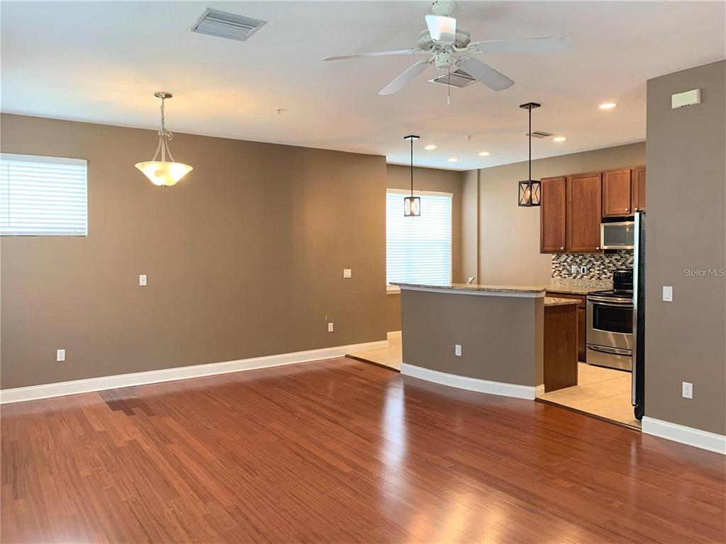 A gated entrance with a brick-paved driveway leads to a multi-story building — 4511 LEGACY PARK DRIVE, TAMPA, FL
