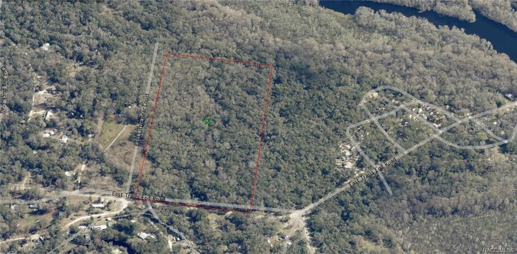 An aerial view shows a rectangular plot of land outlined in red within a forest — 12683 E TRAILS END ROAD, FLORAL CITY, FL
