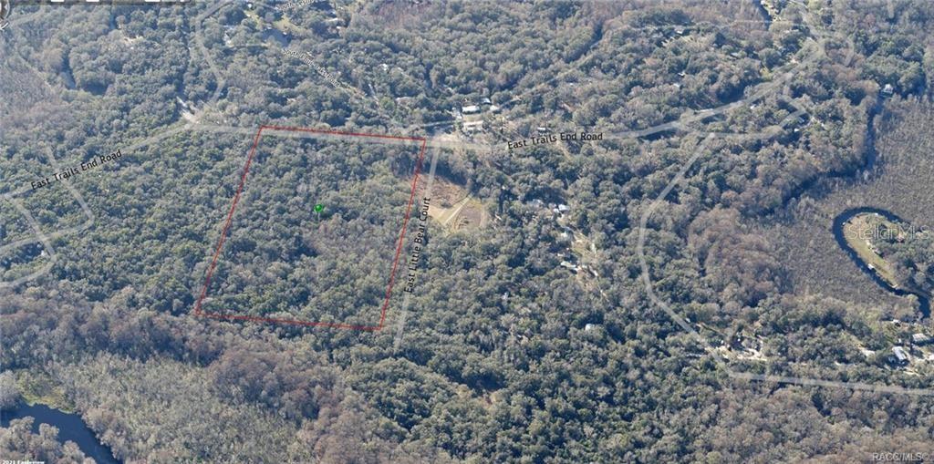 This aerial map shows a wooded, rectangular plot of land outlined in red — 12683 E TRAILS END ROAD, FLORAL CITY, FL