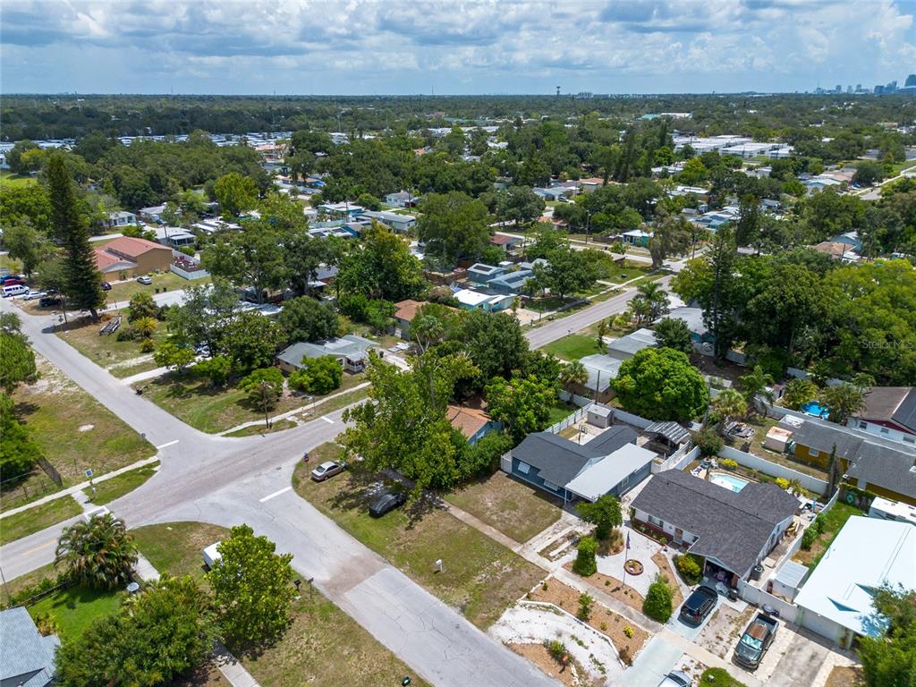 An aerial view of a suburban neighborhood featuring houses, trees, and intersecting streets — 1108 S 55TH STREET, GULFPORT, FL