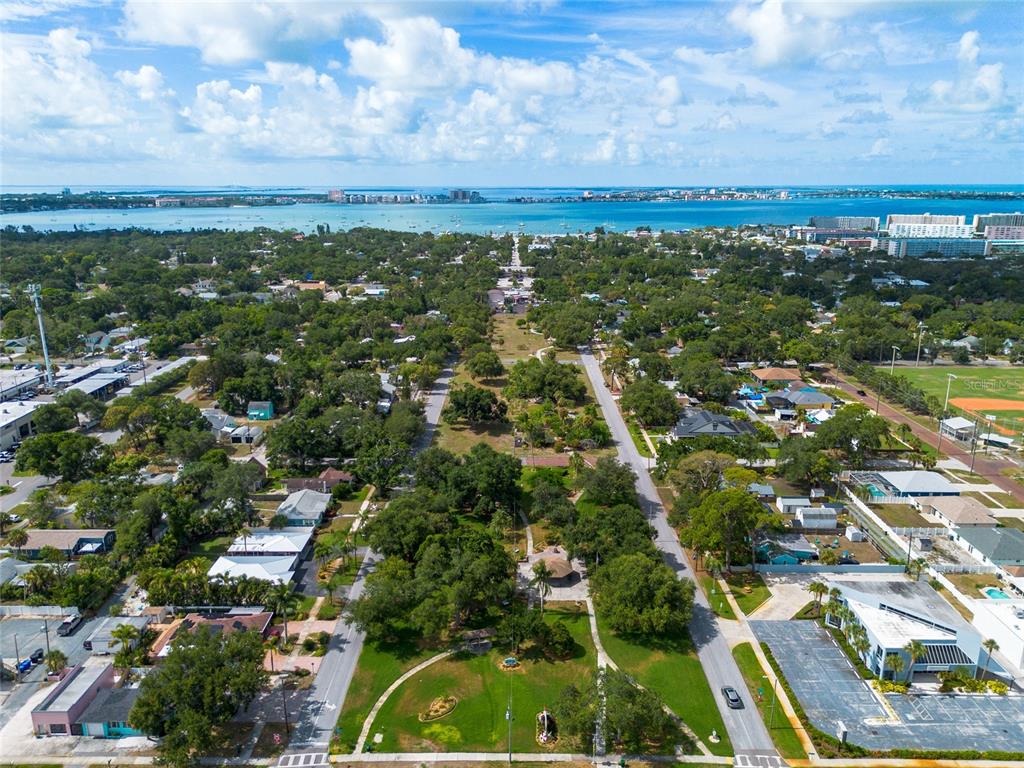 An aerial view shows a park with a gazebo surrounded by residential streets and trees — 1108 S 55TH STREET, GULFPORT, FL