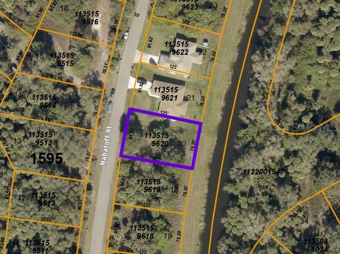 This is an aerial map showing a vacant lot outlined in purple along a street — NABATOFF STREET, NORTH PORT, FL
