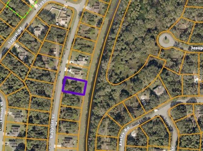 This is an aerial map showing a highlighted vacant lot located along a residential street — NABATOFF STREET, NORTH PORT, FL