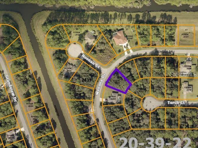 This is an aerial map showing a vacant residential lot outlined in purple — WENONA DRIVE, NORTH PORT, FL