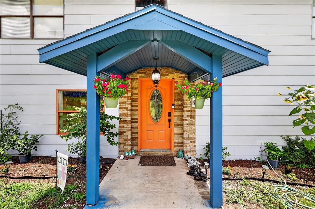 A two-story house with light siding, a blue-trimmed entryway, and an above-ground swimming pool — 3126 TOOLE ROAD, LITHIA, FL