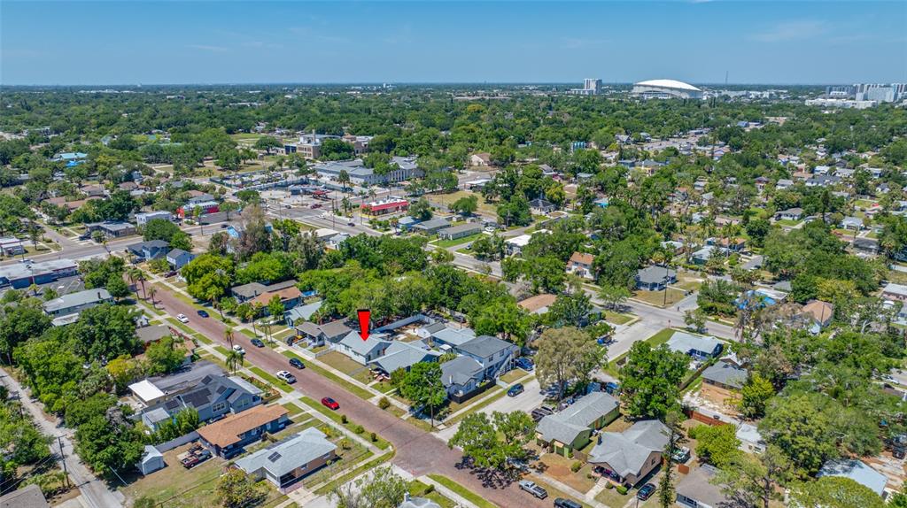 An aerial view shows a residential neighborhood with a red arrow pointing to a house — 821 19TH AVENUE S, ST PETERSBURG, FL
